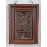 A framed folk art relief work plaster plaque. Depicting a pair of figures and dated 1605, 32.5cm x