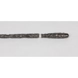 A carved and ebonized folk art walking cane. Inscribed a present from James Becroft.