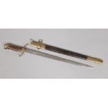 A reproduction Manton & Co. Naval dirk in brass mounted leather scabbard, blade 46cm.Condition