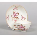 A Worcester teabowl and saucer painted in the Chinese export style with flowers c.1780, saucer 12.