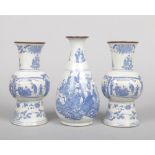 A garniture of three 20th century Chinese blue and white vases. Printed in underglaze blue with