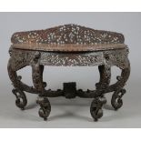 A 19th century Anglo Indian hardwood demi lune console table. Adorned with pierced foliate