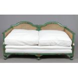 A 1920s two seat settee with double skin bergere sides. With green lacquered chinoiserie