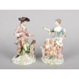 A large pair of 19th century Samson Chelsea figures. Modelled as a lady and gent seated in 18th