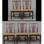 Five matching Chippendale period carved mahogany dining chairs. With carved scrolls to the