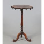A Victorian rosewood centre pedestal occasional table. With cog wheel top adorned with turned