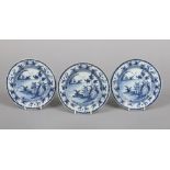 Three 18th century English blue and white delft plates, probably London. Each painted with a Chinese