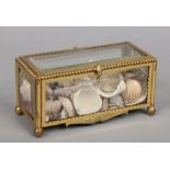 A Continental gilt bronze and bevelled glass casket with hinged cover, 24.25cm wide.