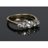 An 18 carat gold five stone diamond ring. Old European cuts approximately 1.05ct, size S 1/2.