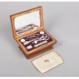 An early 20th century French kingwood necessaire fitted sewing box. With marquetry inlay and