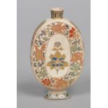 A Japanese Meiji period Satsuma flask. Painted with enamels and gilded with dragons, birds and