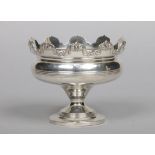 An Edwardian silver pedestal bowl by George Nathan & Ridley Hayes. With castellated rim and reeded