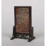 A 19th century Chinese miniature soapstone scholars screen in hardwood mount. Carved to depict a