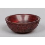 A 20th century miniature Chinese carved horn bowl. Incised with roundels containing shou characters,