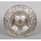 A Victorian Elkington & Co. silver plated dish with a repousse border of fruit, flowers and C-