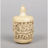 A 19th century Cantonese carved ivory snuff bottle of cylindrical form and decorated in relief