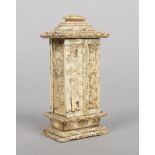 A 19th century Japanese ivory table shrine of pagoda form. Carved to the exterior in low relief with