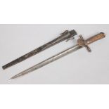 A 19th century German hunting sword with metal scabbard and having antler grip. Blade length, 40cm.