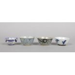 Two Chinese provincial Ming dynasty blue and white bowls and two similar Oriental porcelain bowls.