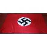 A German World War II third Reich linen banner. Red ground and with swastika motif, 120cm x 180cm.