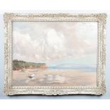 A large early 20th century framed oil on canvas. Coastal scene with two beached boats. Signed