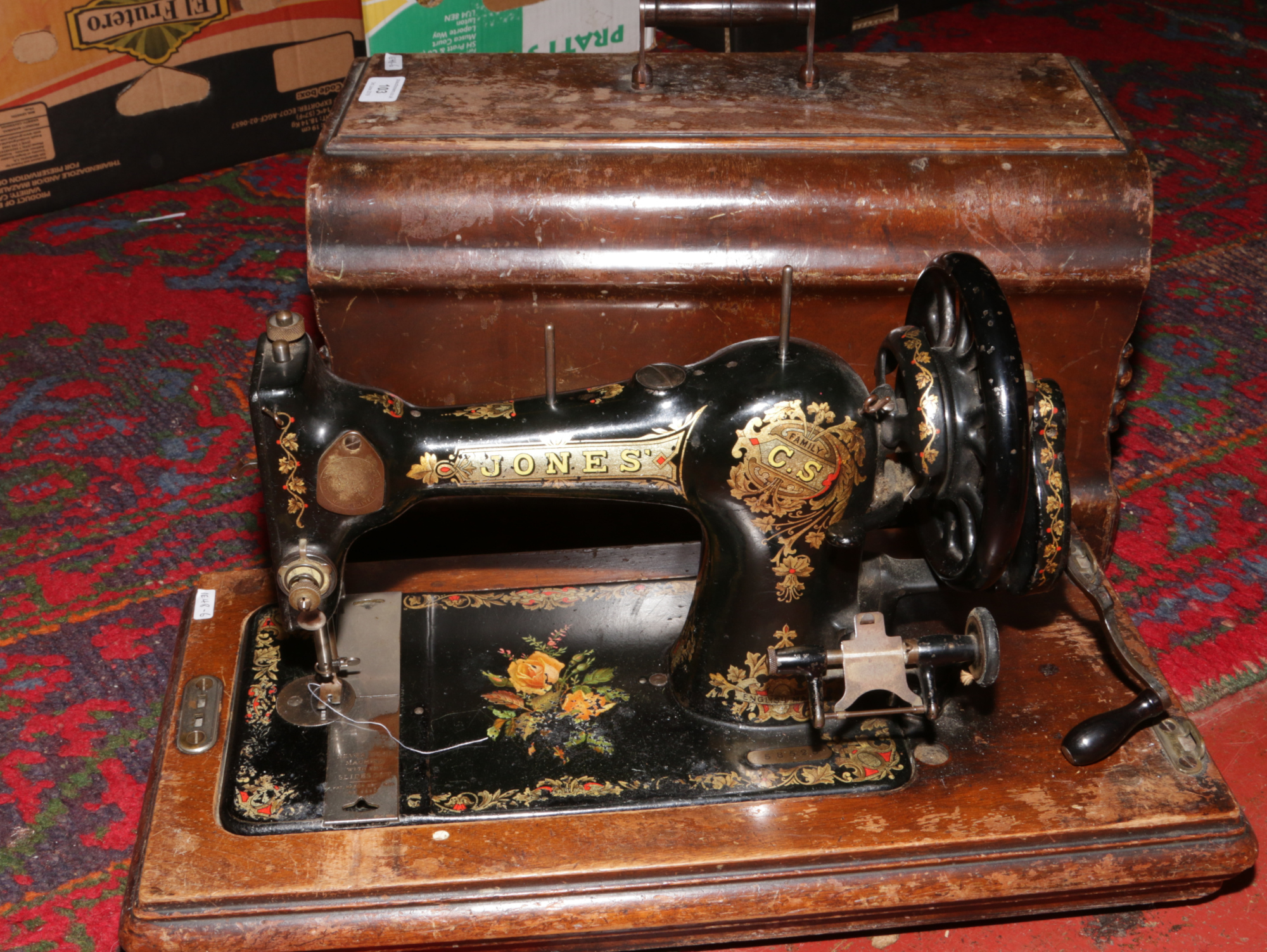 An oak cased Jones Singer sewing machine, lacking lock.