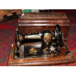 An oak cased Jones Singer sewing machine, lacking lock.
