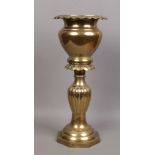 An ornate brass jardiniere stand, 67cm high 30cm diameter.