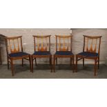 A set of four G-plan teak dining chairs in the 'Egomme' design.