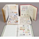 Four albums of Great Britain and American stamps.