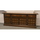 A panelled and carved oak sideboard from the Toledo range by Younger Furniture.