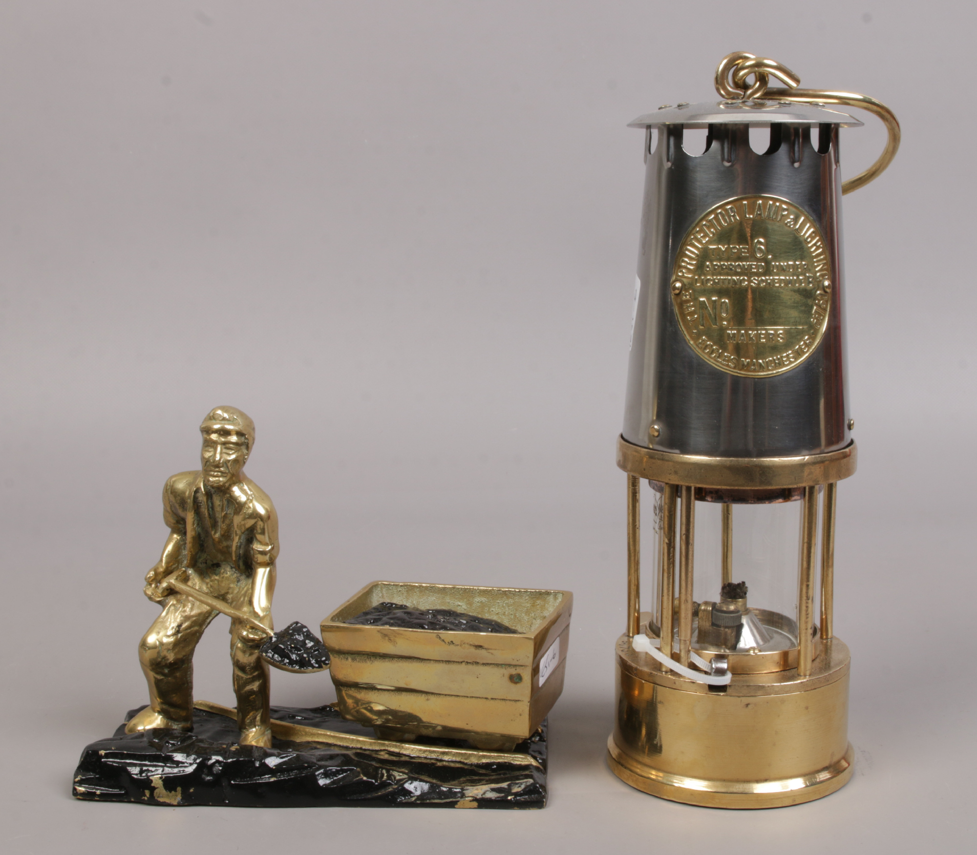 An Eccles type 6 brass and chrome miners re-lightable protector lamp along with a brass figure of