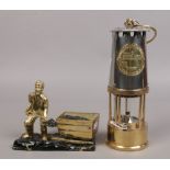 An Eccles type 6 brass and chrome miners re-lightable protector lamp along with a brass figure of