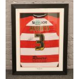 A framed Doncaster Rovers football club shirt signed by Gareth Roberts and presented to PKR