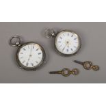 Two silver fob watches with keys.