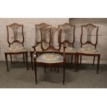 Five mahogany dining chairs to include one carver with pierced backs and tapering supports.