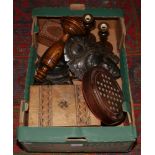 A box of wooden items to include candlesticks, boxes, decorative masks etc.