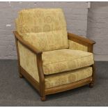 An Ercol Golden Dawn three seat settee and matching arm chair.