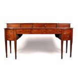 A large Regency mahogany bow fronted sideboard. With raised super structure, strung inlaid Greek key
