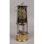 An Eccles type 6RS chrome and brass miners re-lightable protector lamp.
