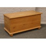 A pine blanket box raised on bun feet.Condition report intended as a guide only.Lid loose.