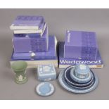 A quantity of mostly boxed Wedgwood Jasperware including plates, trinket boxes, vases etc.