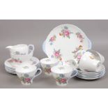 A 21 piece Shelley fine bone chain tea service decorated with sprays of summer flowers with one