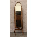 An antique walnut dome top cheval mirror on stand with turned finials.Condition report intended as a