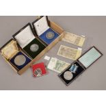 A box of various medals to also include some bank notes.
