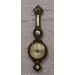 An early 19th century mahogany cased banjo barometer. Maker L. Monastere.