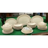 An Art Deco Mintons dinner service with ivory ground and painted brown enamels including serving