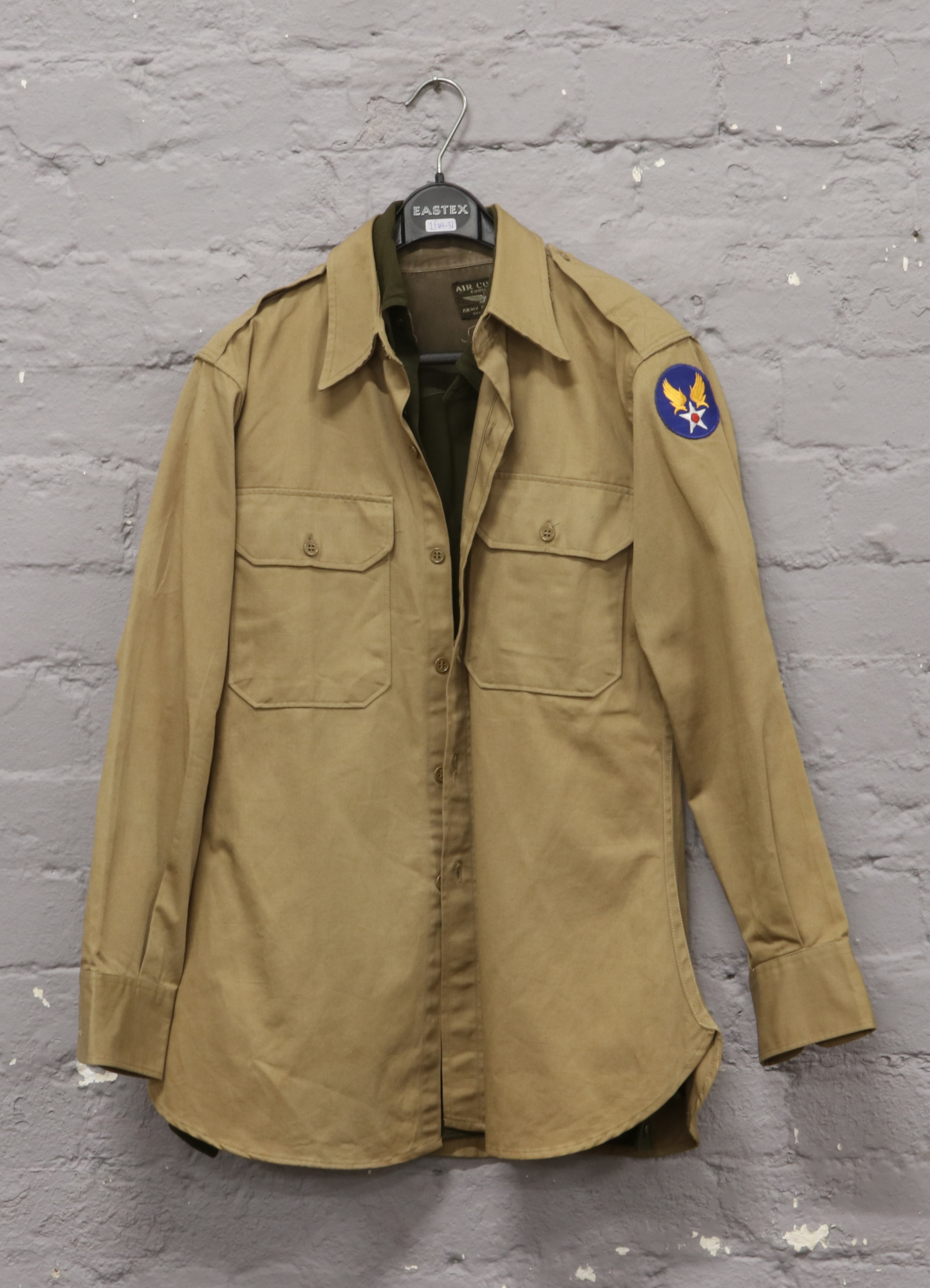 A post World War II US military heavy twill tan shirt with US Airforce patch to shoulder, along with