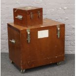 A large wheeled hardwood flight case. Possibly military with stenciled sides along with a similar