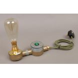 Industrial art table lamp formed from painted steel conduit with over sized filament bulb and
